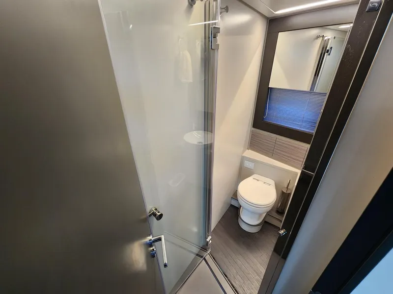 Slide: The Image of Modern bathroom in 2022 Pershing 6X yacht with shower and toilet. - 24