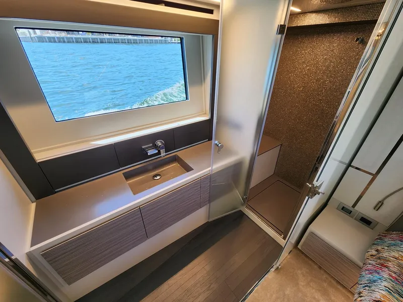 Slide: The Image of Luxurious bathroom interior of 2022 Pershing 6X yacht with ocean view window. - 26