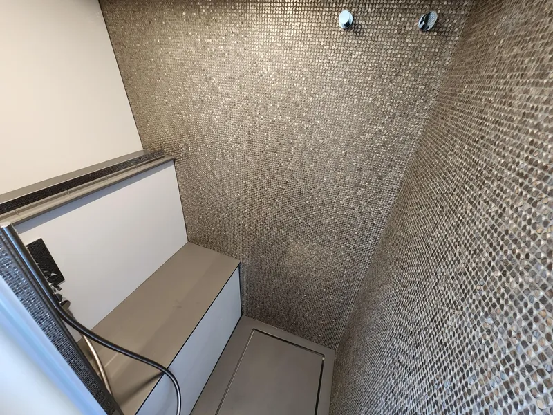 Slide: The Image of Shower area in 2022 Pershing 6X yacht with mosaic tile walls. - 27