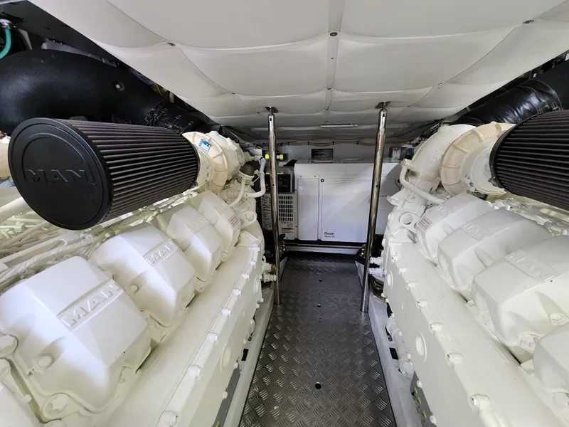 Slide: The Image of Engine room of 2022 Pershing 6X yacht, featuring dual MAN engines. - 29