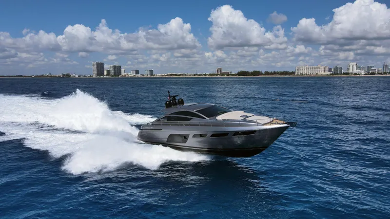Slide: The Image of 2022 Pershing 6X yacht cruising on open sea under clear blue sky. - 3