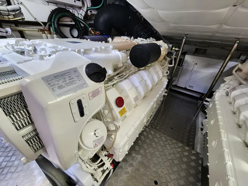 Slide: The Image of Engine room of 2022 Pershing 6X yacht, featuring advanced machinery and equipment. - 30