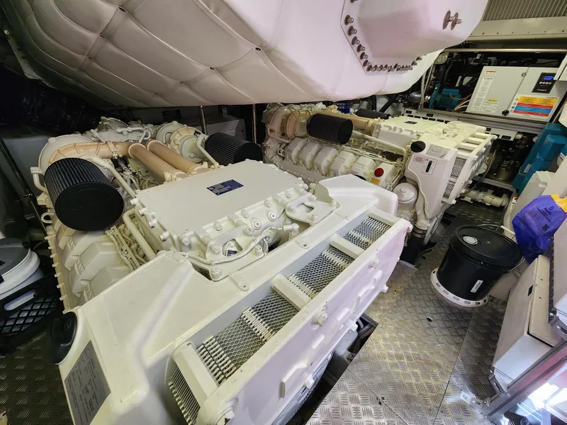 Slide: The Image of Engine room of 2022 Pershing 6X yacht, showcasing powerful marine engines. - 31