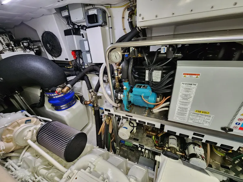 Slide: The Image of Engine room of 2022 Pershing 6X yacht, showcasing mechanical components and systems. - 33