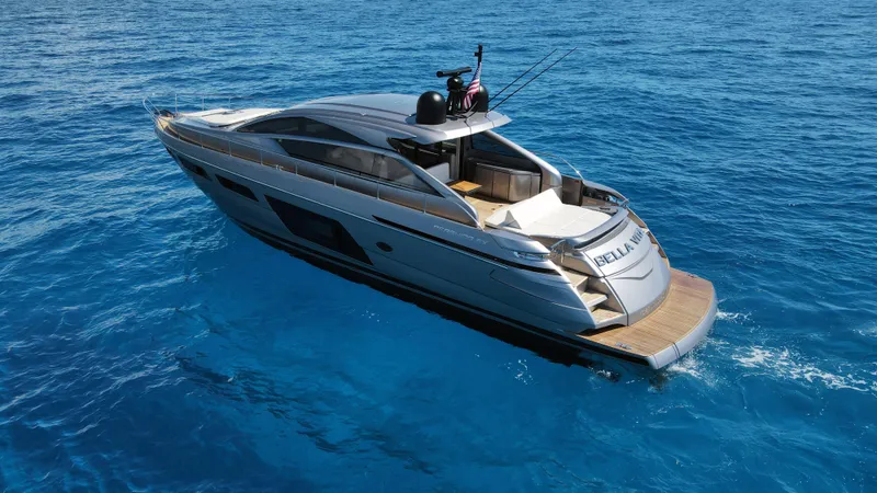 Slide: The Image of 2022 Pershing 6X yacht cruising on clear blue ocean waters. - 5