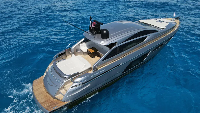 Slide: The Image of 2022 Pershing 6X yacht cruising on clear blue water. - 6