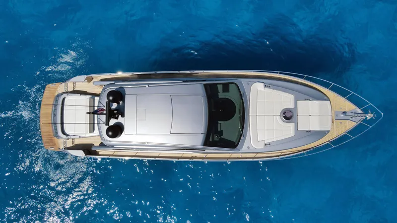 Slide: The Image of Aerial view of 2022 Pershing 6X yacht on clear blue water. - 9