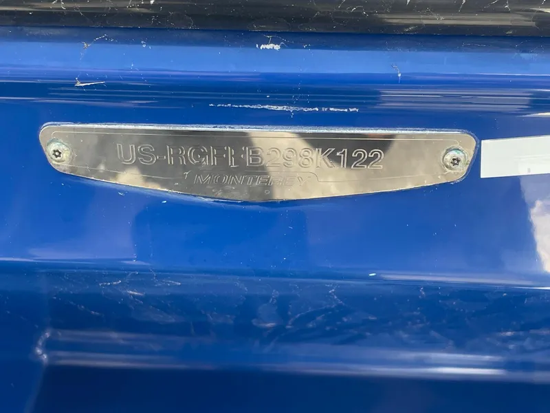 Slide: The Image of 2022 Monterey M-205 boat identification plate on blue surface. - 3