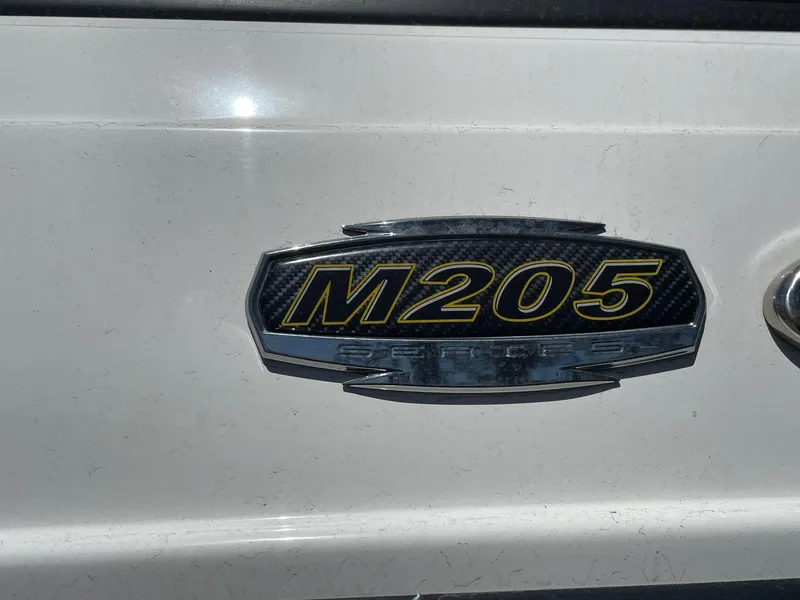 Slide: The Image of 2022 Monterey M-205 emblem on a white surface. - 4