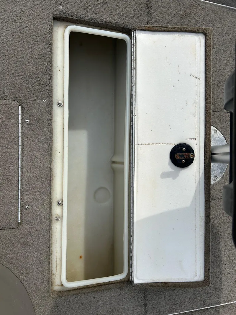 Slide: The Image of 2004 Crestliner 1750 FishHawk SC boat storage compartment, open and empty. - 27