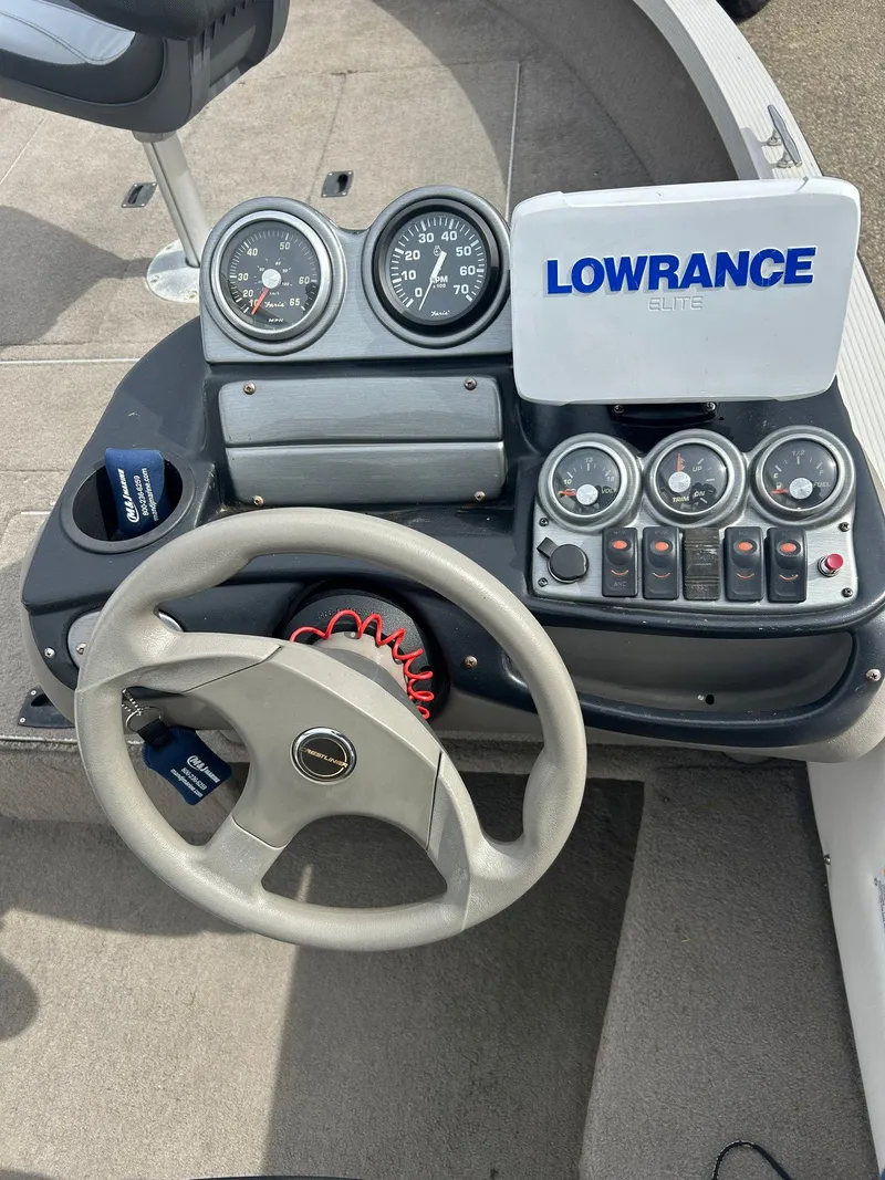 Slide: The Image of 2004 Crestliner 1750 FishHawk SC dashboard with Lowrance Elite fishfinder and gauges. - 5