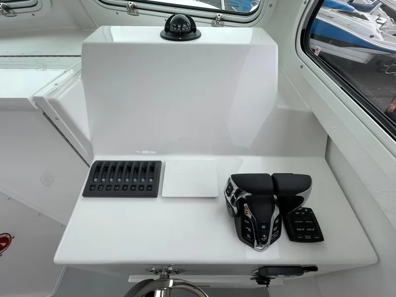Slide: The Image of Control panel of 2025 Steiger Craft 255 DV MIAMI boat, featuring modern navigation equipment. - 11