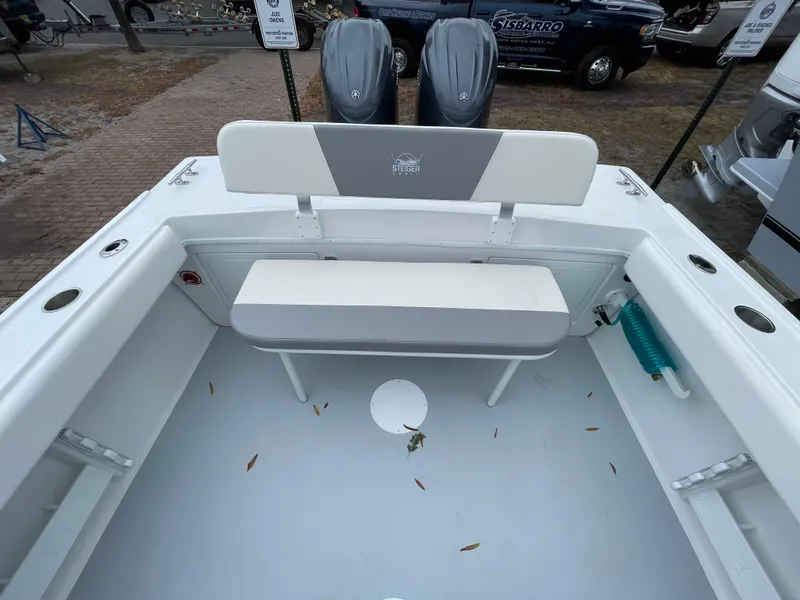 Slide: The Image of 2025 Steiger Craft 255 DV MIAMI boat interior with seating and dual engines. - 2