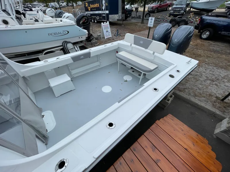 Slide: The Image of 2025 Steiger Craft 255 DV MIAMI boat deck with seating and twin engines. - 3