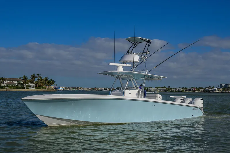 Slide: The Image of 2017 Bahama 41 boat cruising on calm waters under a clear blue sky. - 0