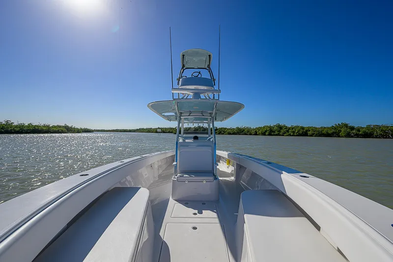 Slide: The Image of 2017 Bahama 41 boat on calm water under clear blue sky. - 1