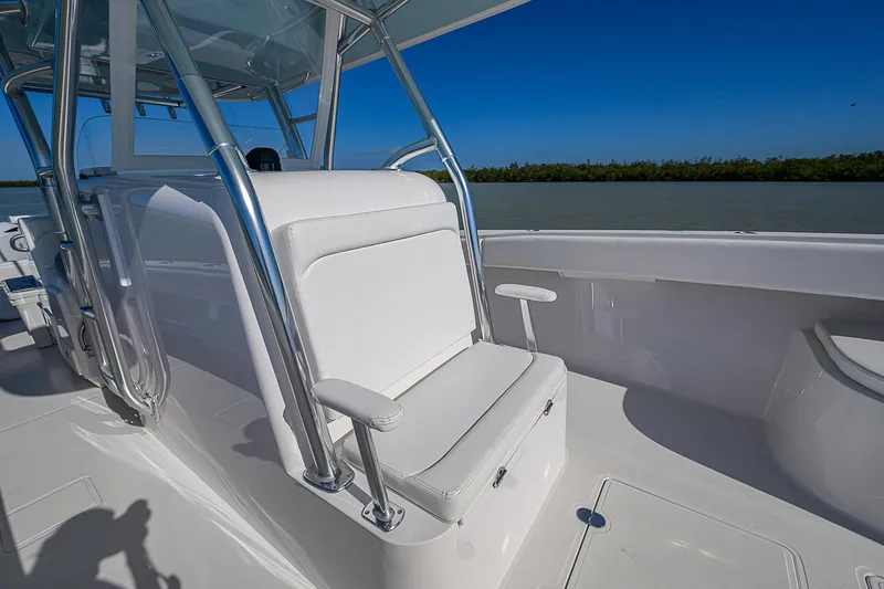 Slide: The Image of 2017 Bahama 41 boat interior with white seating and chrome accents. - 10