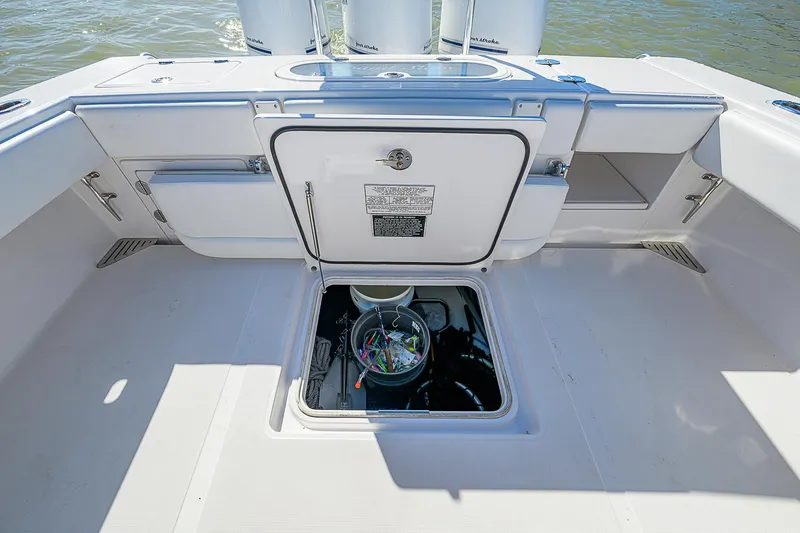 Slide: The Image of 2017 Bahama 41 boat deck with storage compartments and fishing gear. - 16