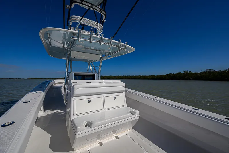 Slide: The Image of 2017 Bahama 41 boat with sleek design on calm waters under clear blue sky. - 19