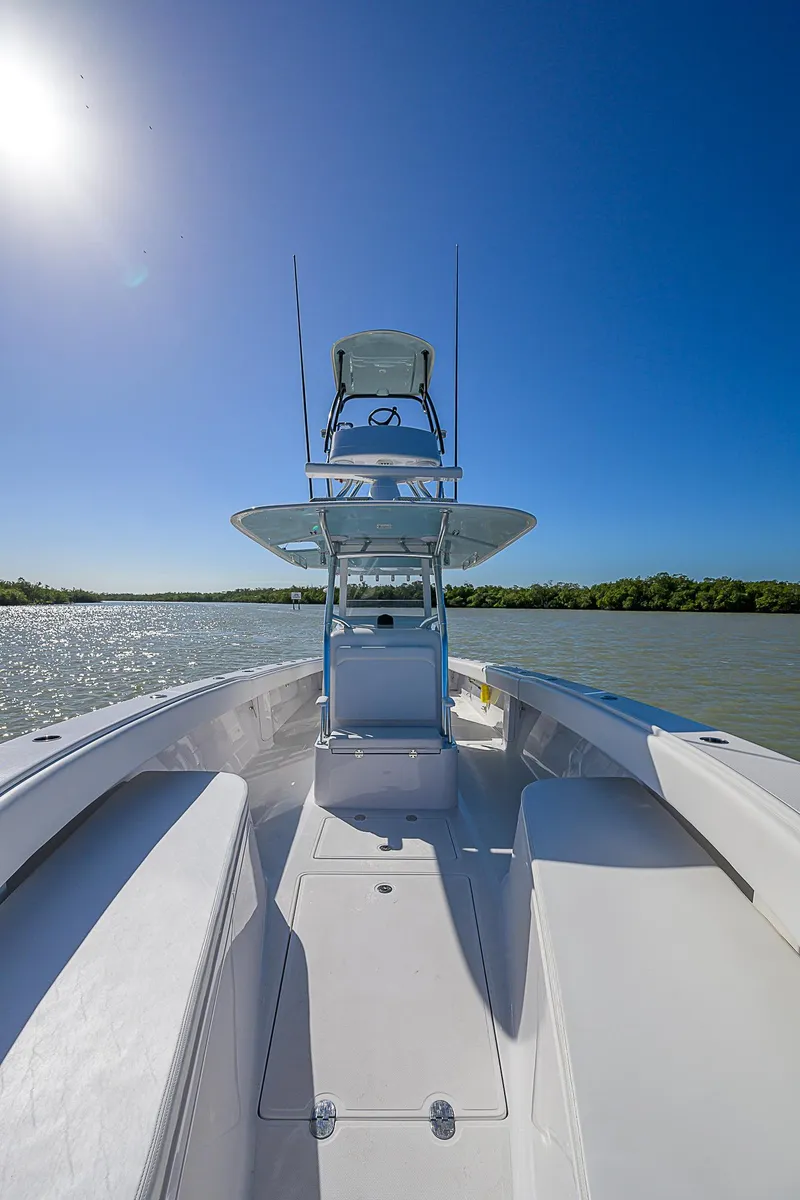 Slide: The Image of 2017 Bahama 41 boat on water under clear blue sky. - 2