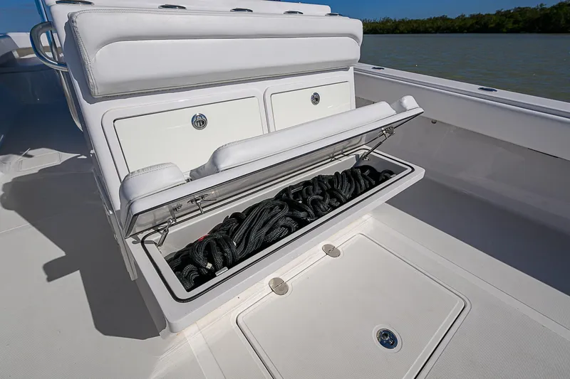 Slide: The Image of 2017 Bahama 41 boat storage compartment with coiled ropes on deck. - 20