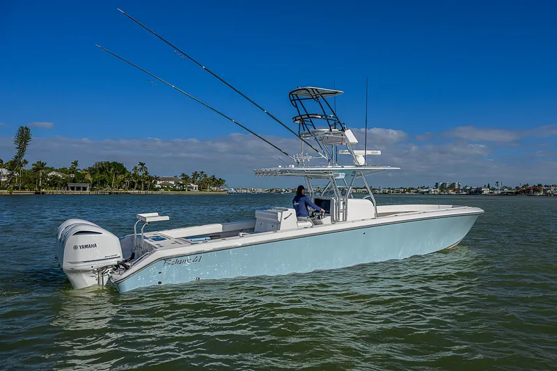 Slide: The Image of 2017 Bahama 41 boat on calm water with clear blue sky. - 35