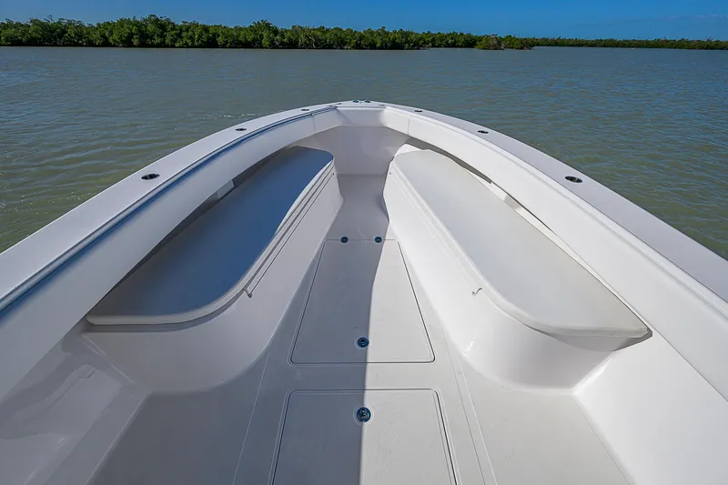 Slide: The Image of Bow view of 2017 Bahama 41 boat on calm water, clear sky background. - 4