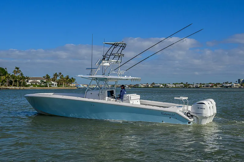 Slide: The Image of 2017 Bahama 41 boat cruising on a sunny day with clear blue skies. - 42