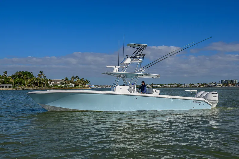 Slide: The Image of 2017 Bahama 41 boat cruising on a sunny day with clear blue skies. - 45