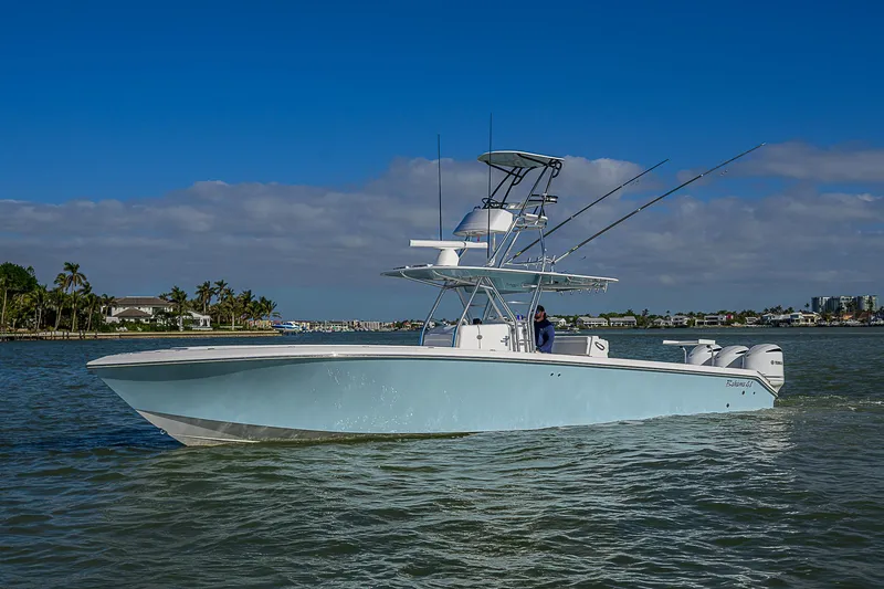 Slide: The Image of 2017 Bahama 41 boat cruising on calm waters under a clear blue sky. - 46