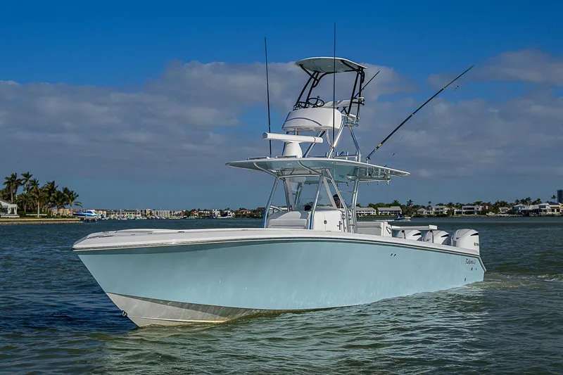 Slide: The Image of 2017 Bahama 41 boat cruising on calm waters under a clear blue sky. - 47