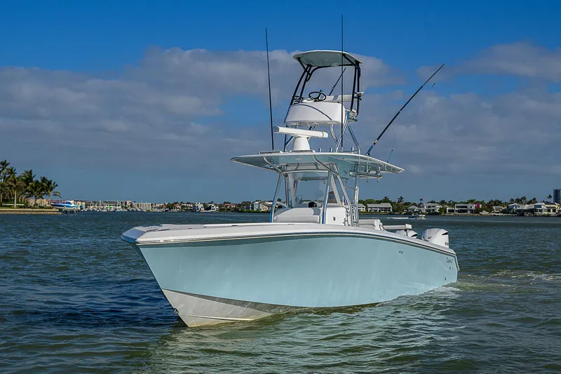 Slide: The Image of 2017 Bahama 41 boat cruising on a sunny day with clear skies. - 48