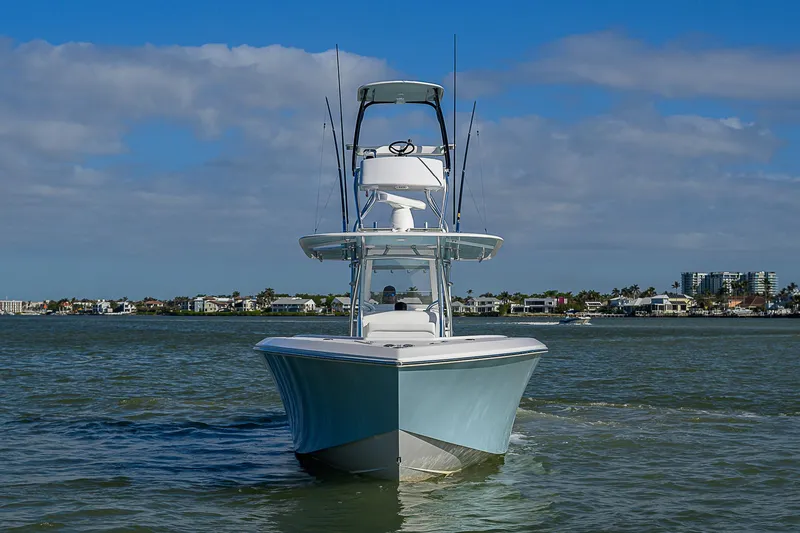 Slide: The Image of 2017 Bahama 41 boat on water, clear sky, coastal background. - 49