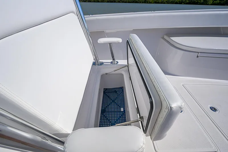 Slide: The Image of Open storage compartment on 2017 Bahama 41 boat with white seating. - 8