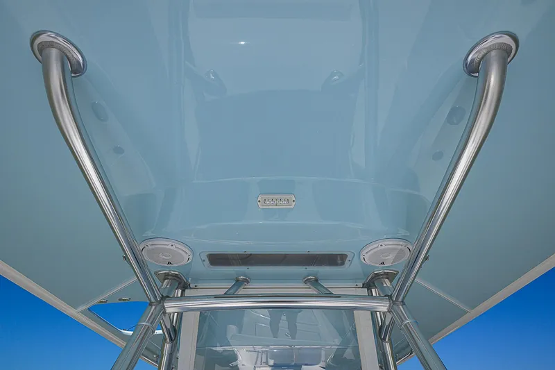Slide: The Image of Bahama 41 boat, 2017 model, featuring sleek metal framework and blue canopy. - 9