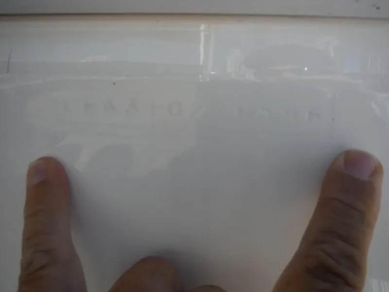 Slide: The Image of 1996 Intrepid 339 Walk Around boat engine and propeller detail on a trailer. - 12