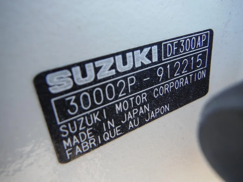 Slide: The Image of Fingers pointing at hull identification number on 1996 Intrepid 339 Walk Around boat. - 13