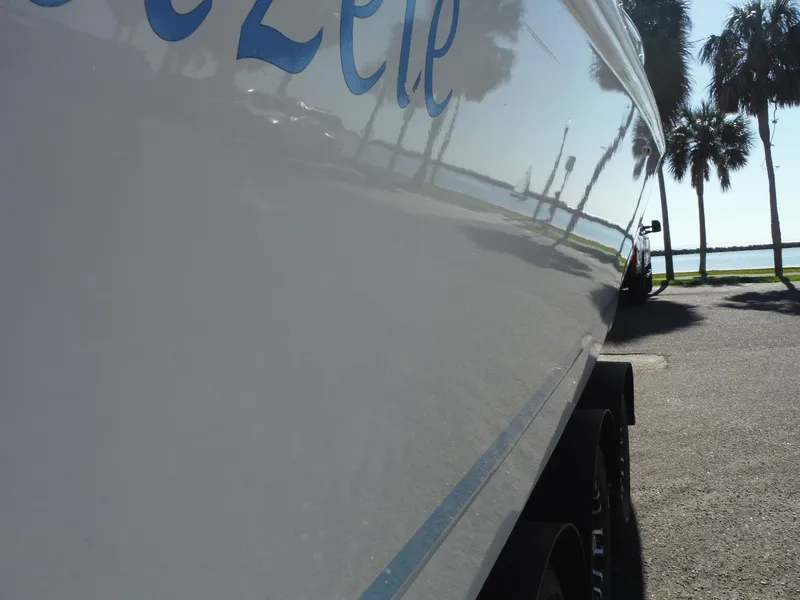 Slide: The Image of Fingers pointing at hull identification number on 1996 Intrepid 339 Walk Around boat. - 16