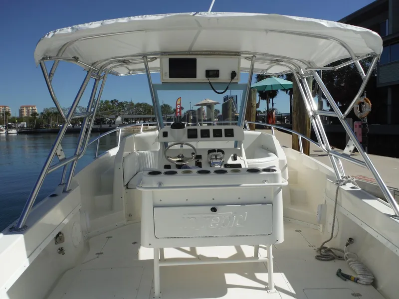 Slide: The Image of Twin Suzuki 300 outboard engines on a 1996 Intrepid 339 Walk Around boat. - 22