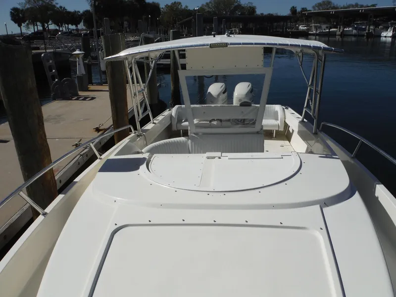 Slide: The Image of Chrome anchor winch on 1996 Intrepid 339 Walk Around boat deck. - 30