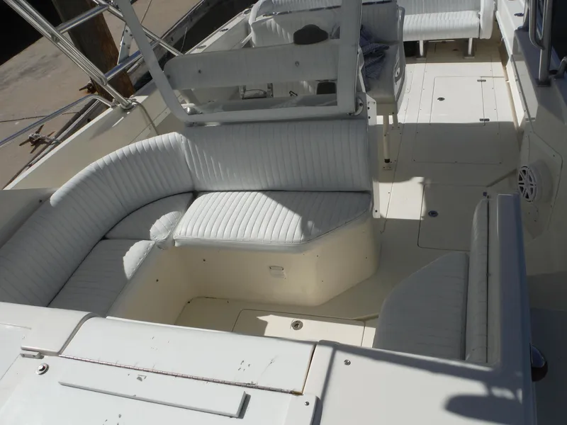 Slide: The Image of 1996 Intrepid 339 Walk Around boat docked at a marina. - 31