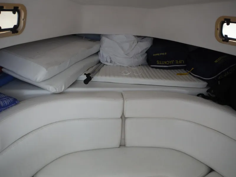 Slide: The Image of 1996 Intrepid 339 Walk Around interior with sink, mini fridge, and seating area. - 37