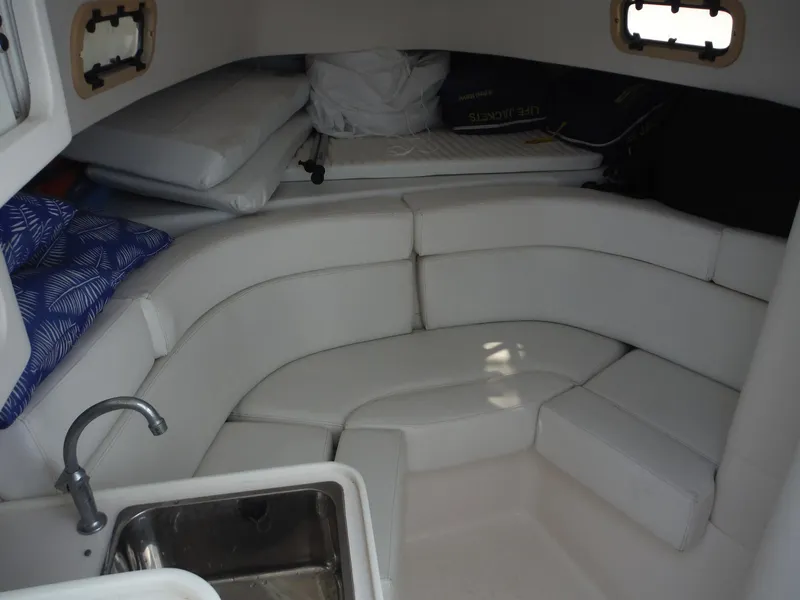 Slide: The Image of 1996 Intrepid 339 Walk Around boat canopy and helm area with clear enclosure. - 43