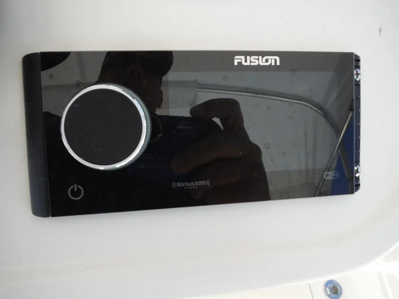 Slide: The Image of 1996 Intrepid 339 Walk Around cabin interior with sink, seating, and storage. - 45