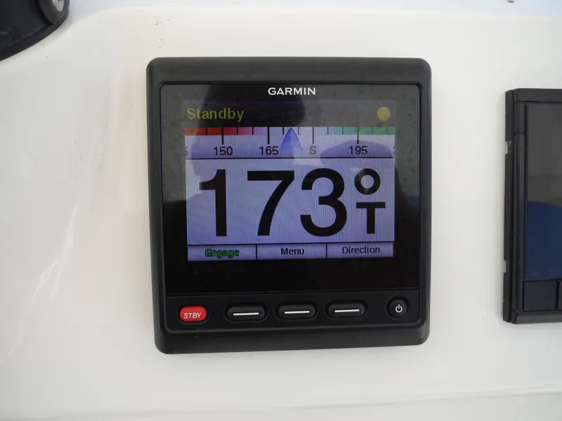 Slide: The Image of Close-up of Suzuki engine display showing 256.26 hours on Intrepid 339 Walk Around, 1996 model. - 48