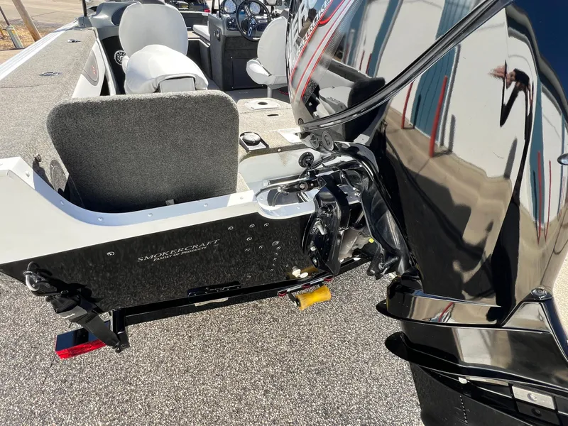 Slide: The Image of 2017 Smoker Craft 172 Ultima Fish n Ski boat, rear view with motor and seating. - 10