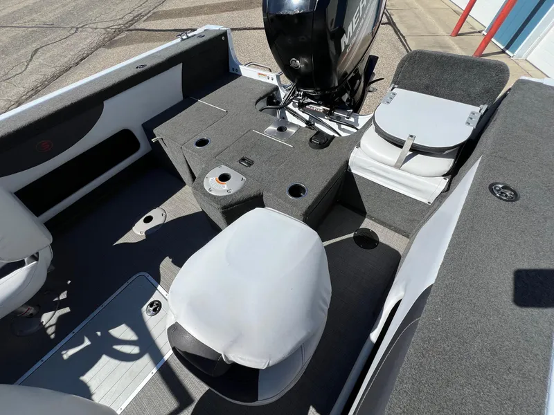 Slide: The Image of 2017 Smoker Craft 172 Ultima Fish n Ski boat interior with seating and motor. - 11