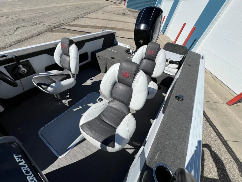Slide: The Image of 2017 Smoker Craft 172 Ultima Fish n Ski boat interior with seating and motor. - 13