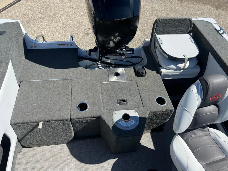 Slide: The Image of 2017 Smoker Craft 172 Ultima Fish n Ski boat interior with seating and motor. - 19