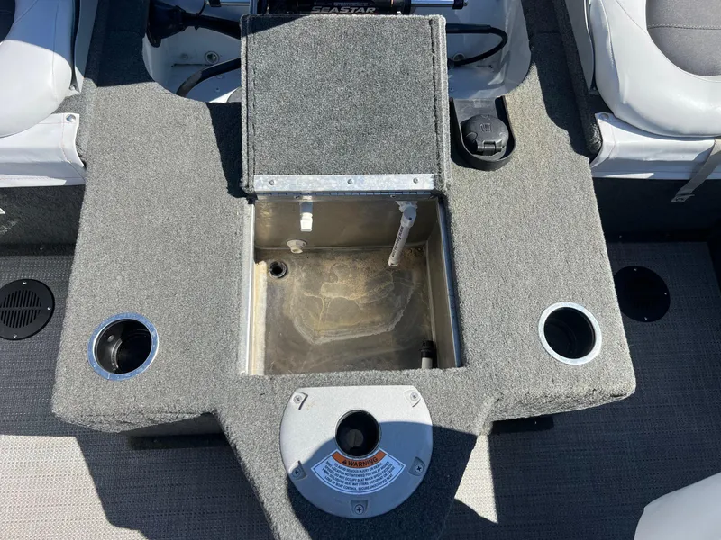 Slide: The Image of 2017 Smoker Craft 172 Ultima Fish n Ski boat interior with storage compartment and cup holders. - 23